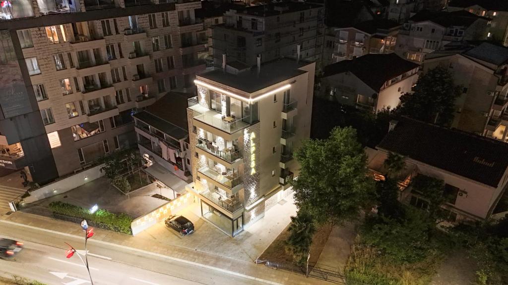 an overhead view of a building at night with lights at Alpesa Apartments in Budva
