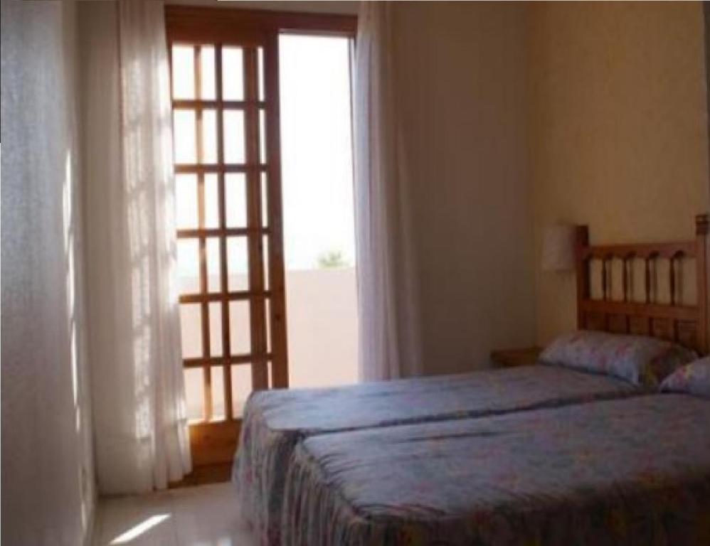Postel nebo postele na pokoji v ubytování Apartamentos Rayos de Sol
