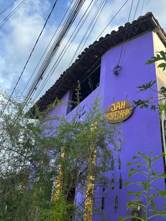 a purple building with a sign on the side of it at Jahospedaria & Ecoturismo in Lençóis
