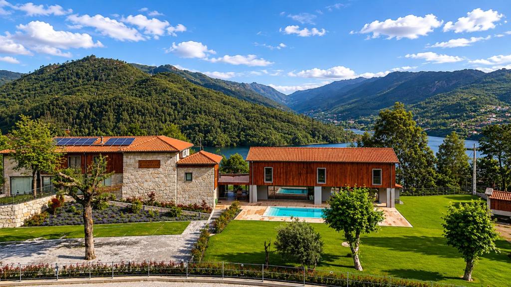 an estate with a view of a lake and mountains at Villa Lijó Suites in Rio Caldo
