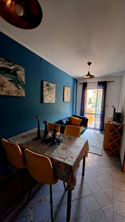 a living room with a table and a couch at Apartman Rab Blue in Rab