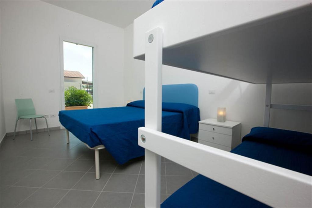 Postel nebo postele na pokoji v ubytování Camping Blu Fantasy