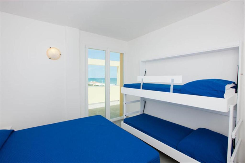 Postel nebo postele na pokoji v ubytování Camping Blu Fantasy