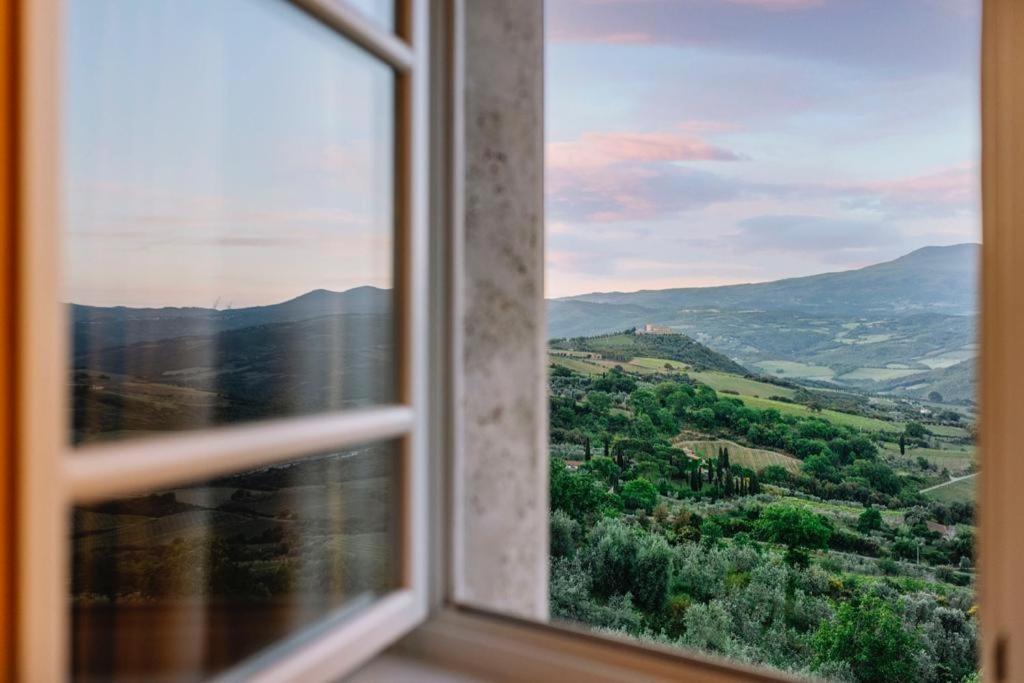 a window with a view of a mountain view at Val D'Orcia Panoramic Suite in Montalcino