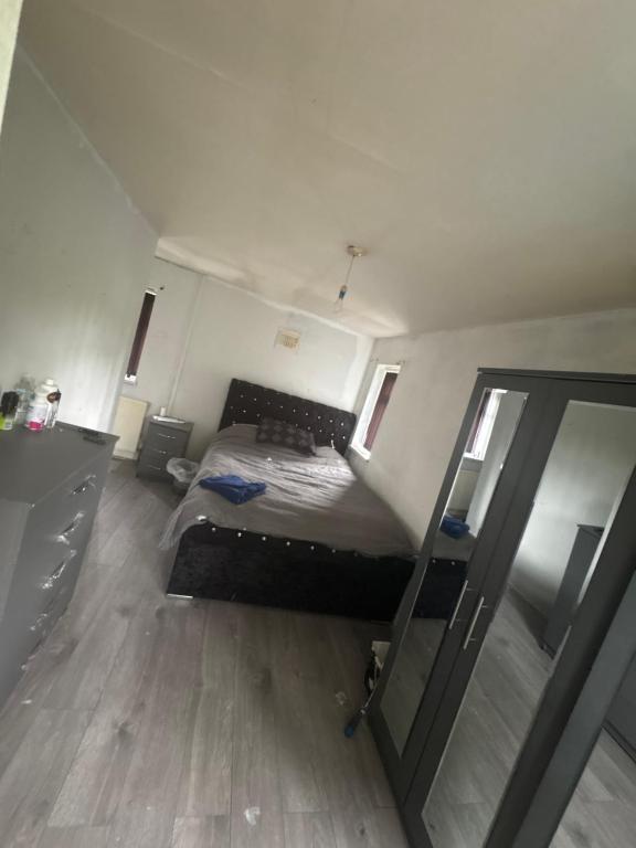 a bedroom with a bed and a mirror at Hunters lodge in Blackpool