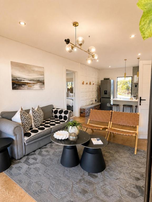 a living room with a couch and a table at Bergview Apartments in Hilton