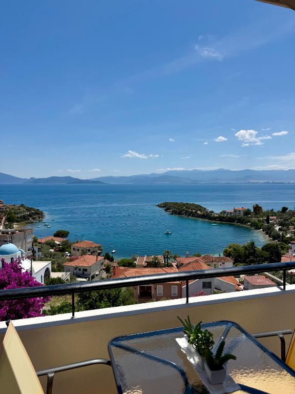 a view of the ocean from a balcony at Blue Horizon Balcony in Volos