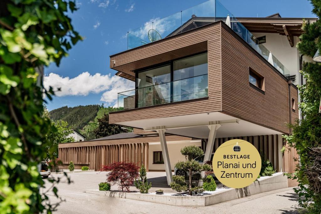 a building with a sign in front of it at ''die Bergerin'' | Appartements Schladming in Schladming