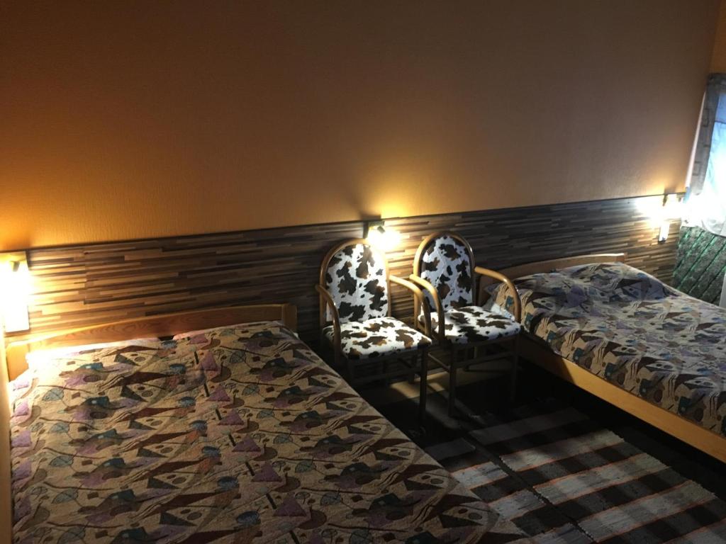 Postel nebo postele na pokoji v ubytování Tolli Hostel & Holiday House