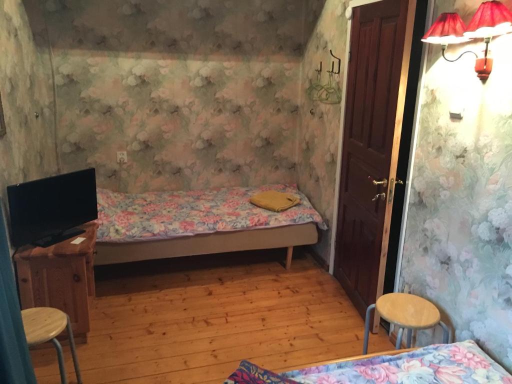 Postel nebo postele na pokoji v ubytování Tolli Hostel & Holiday House