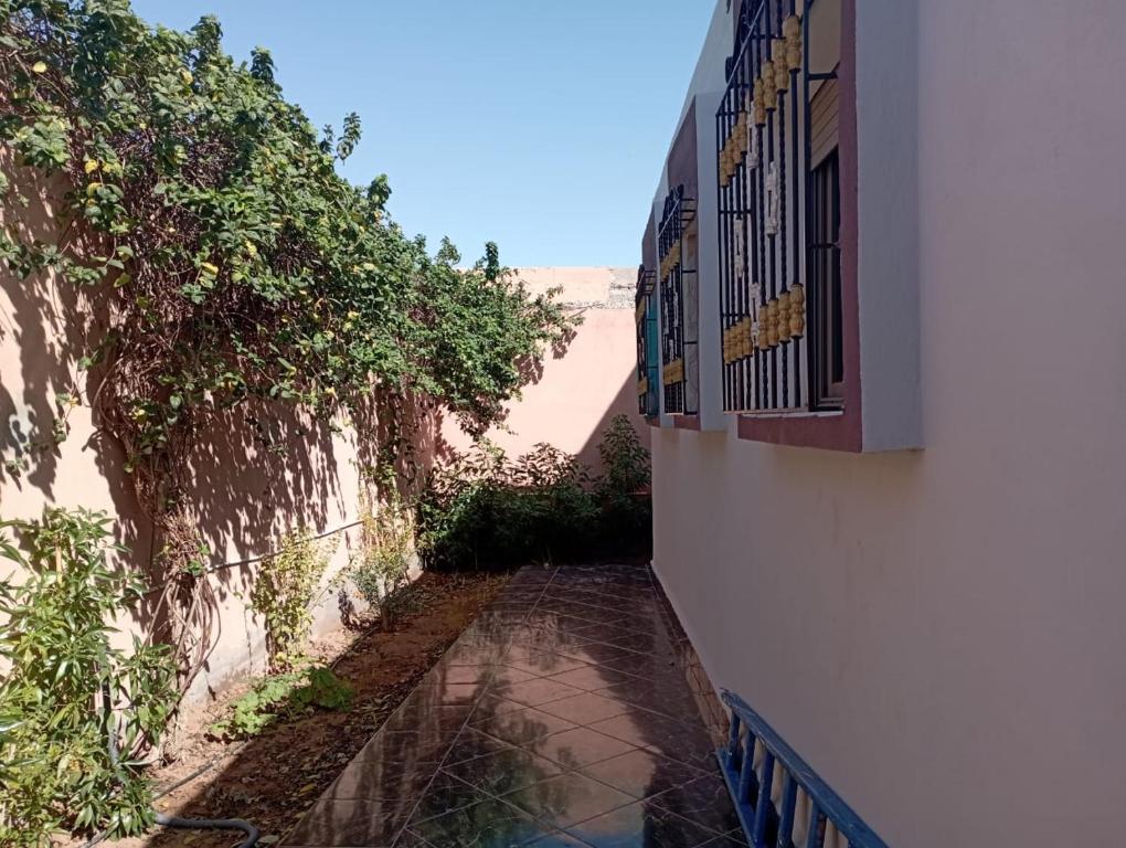 a walkway between two buildings next to a building at Kaltouma in Sidi Bibi