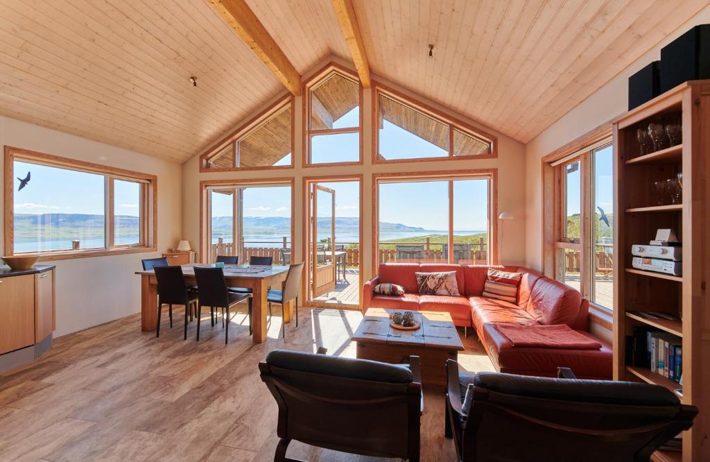 a living room with a couch and a table at Brekka in Akranes