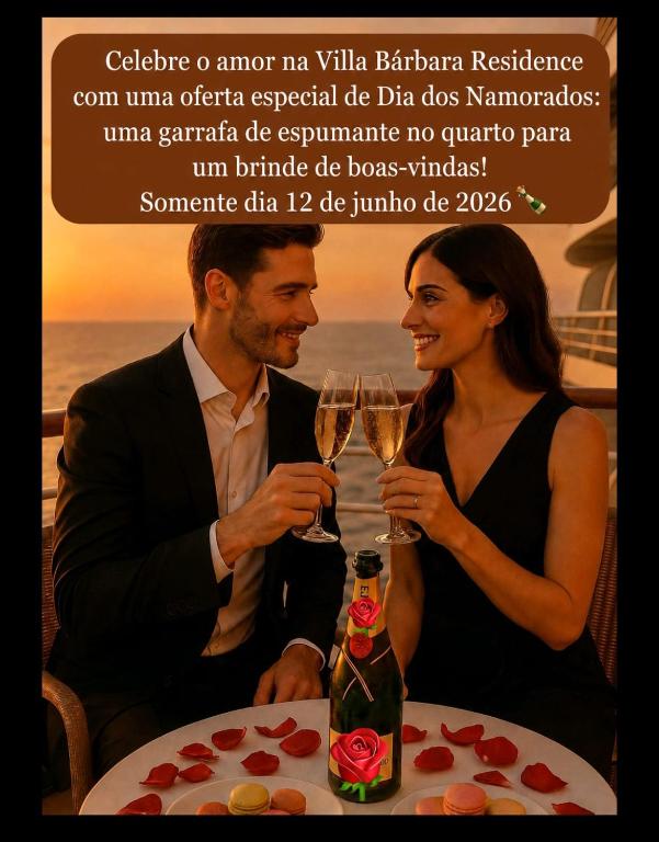 a man and a woman sitting at a table with champagne glasses at Villa Bárbara residência in Aracaju