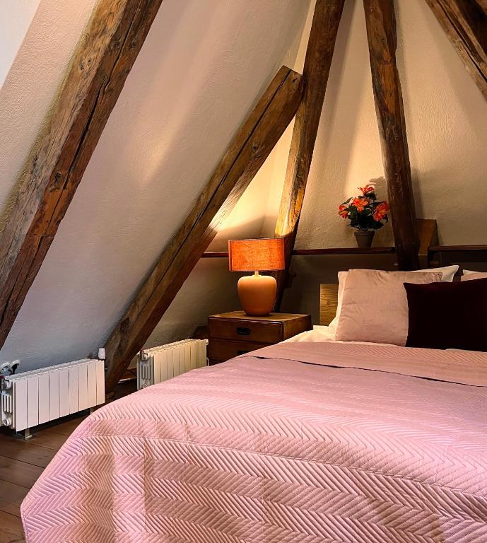 a bedroom with a bed in a attic at Reval Residences Old Town in Tallinn