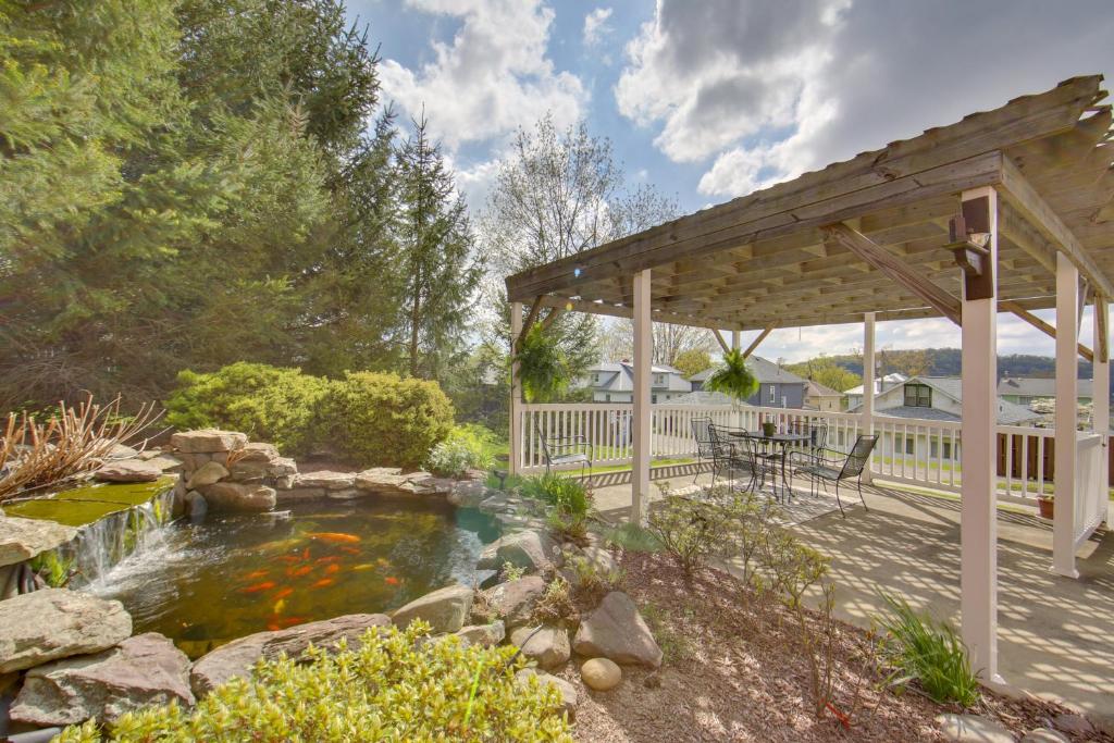 a backyard with a koi pond and a gazebo at Work, Play & Explore: 9-Unit New Kensington Base in New Kensington