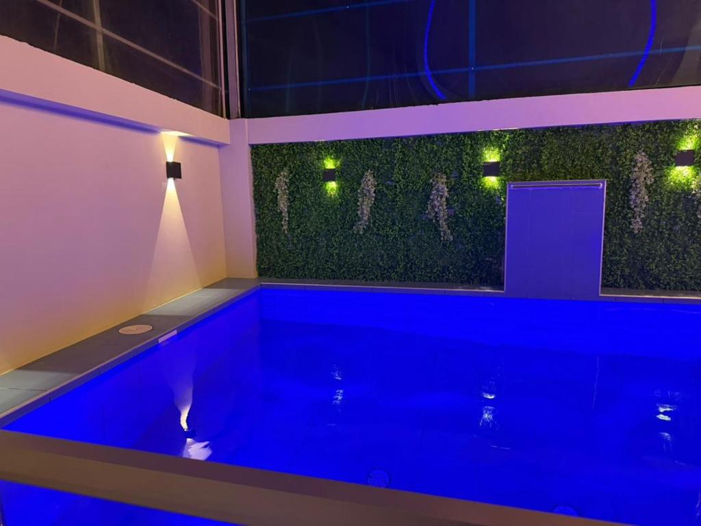 a large blue bath tub in a room at Casa Apartment Playa Tortugas in Tortuga