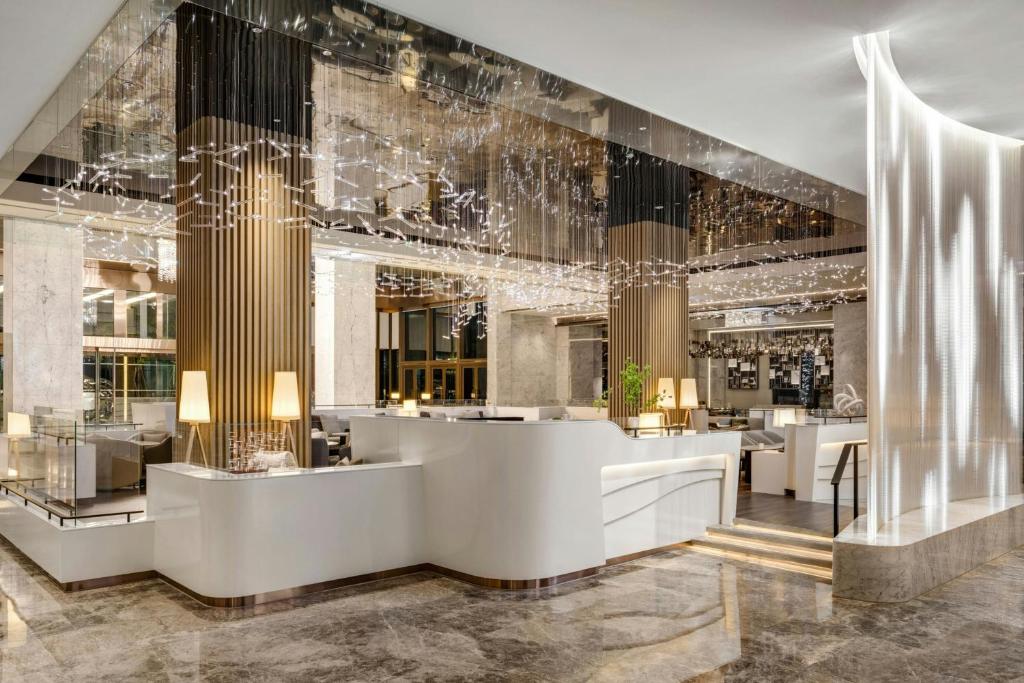 a lobby of a hotel with a reception desk at Kaohsiung Marriott Hotel in Kaohsiung