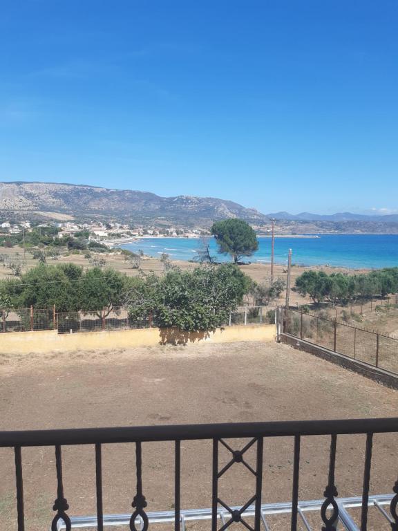 a view of the ocean from a balcony at Savvas Apartments in Plytra