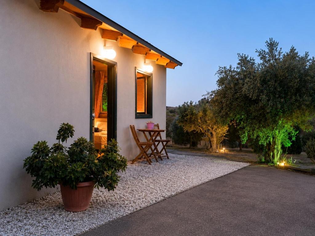 a house with a table outside of it at Olive Grove in Anavyssos