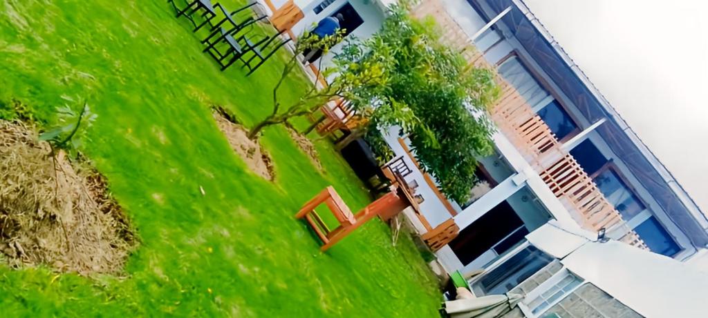 an aerial view of a building with green grass at MATENI's B&B in Naivasha
