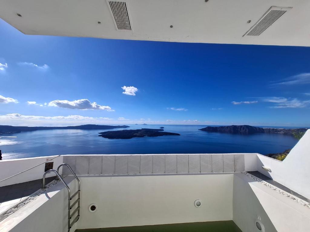 a room with a view of the water at SMART Emboreio stay in Emporio