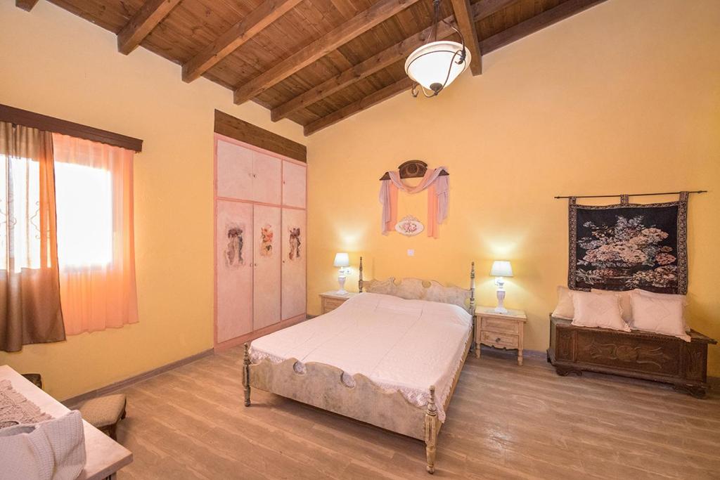 Postel nebo postele na pokoji v ubytování Villa Feakia
