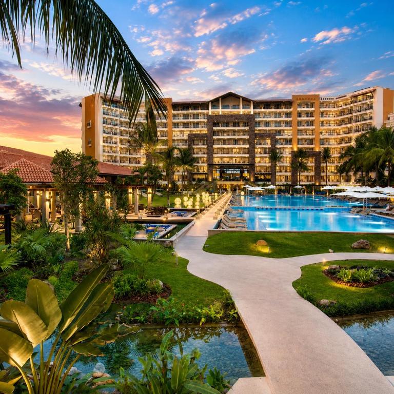 a hotel with a pool and a resort at Luxury Beachfront Condo at Krystal Grand Resort - NEWLY REMODELED & NEWLY FURNISHED in Bucerías