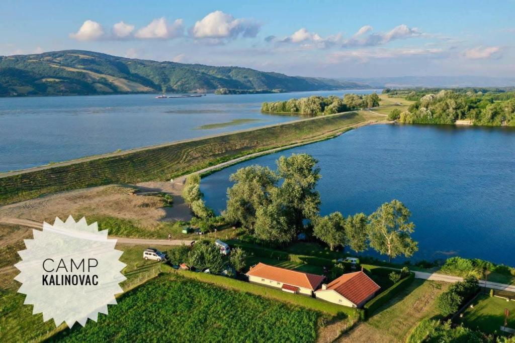 an aerial view of a lake with a house at Camp Kalinovac in Zatonje