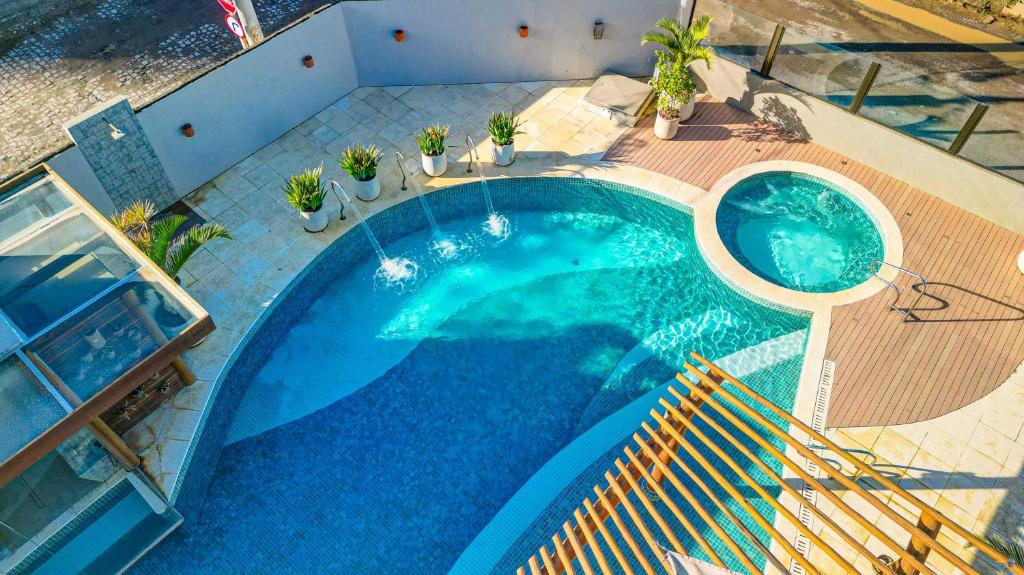 an overhead view of a blue swimming pool at Pousada Praia Bela in Ilhéus