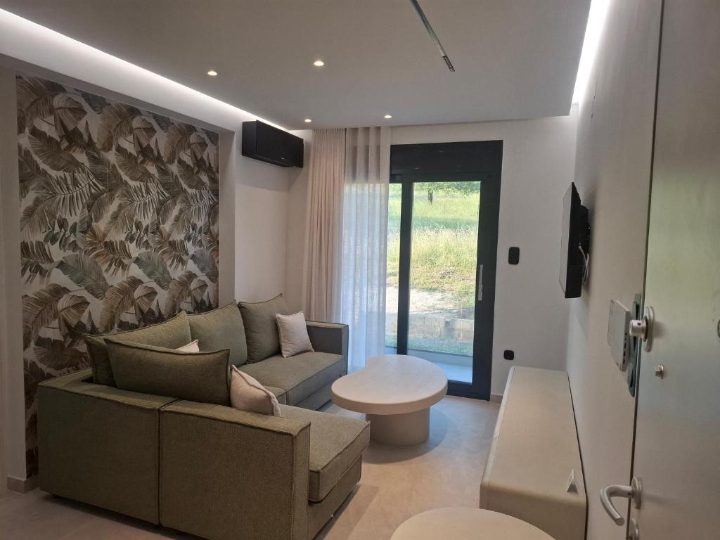 a living room with a couch and a table at Minimal Nature Escape in Ioannina