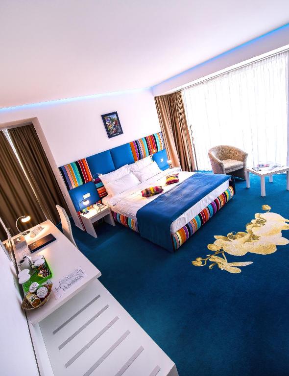 Postel nebo postele na pokoji v ubytování Marshal Garden Hotel
