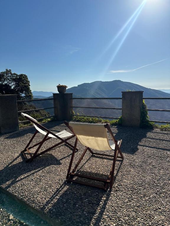 a chair sitting on the ground with a view at Mas Eucaliptus in Susqueda