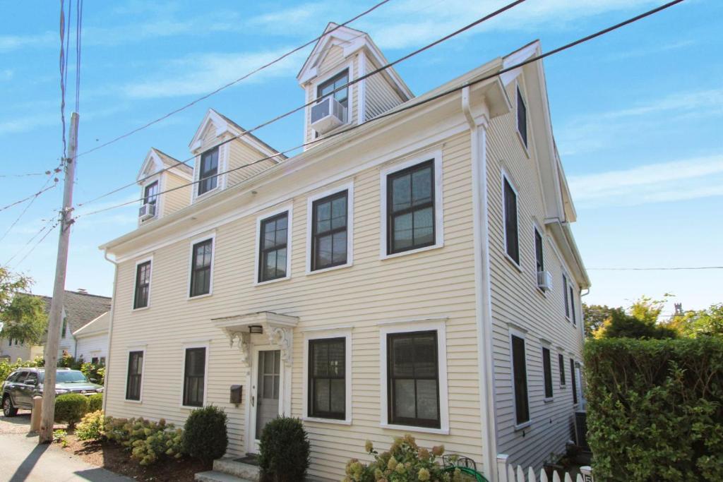 a white house with a turret at Harbor Hideaway in Provincetown