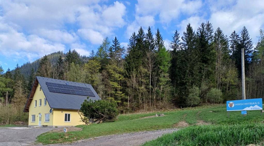 a house with solar panels on the side of a road at Appartements Dorner, Semmering in Steinhaus am Semmering