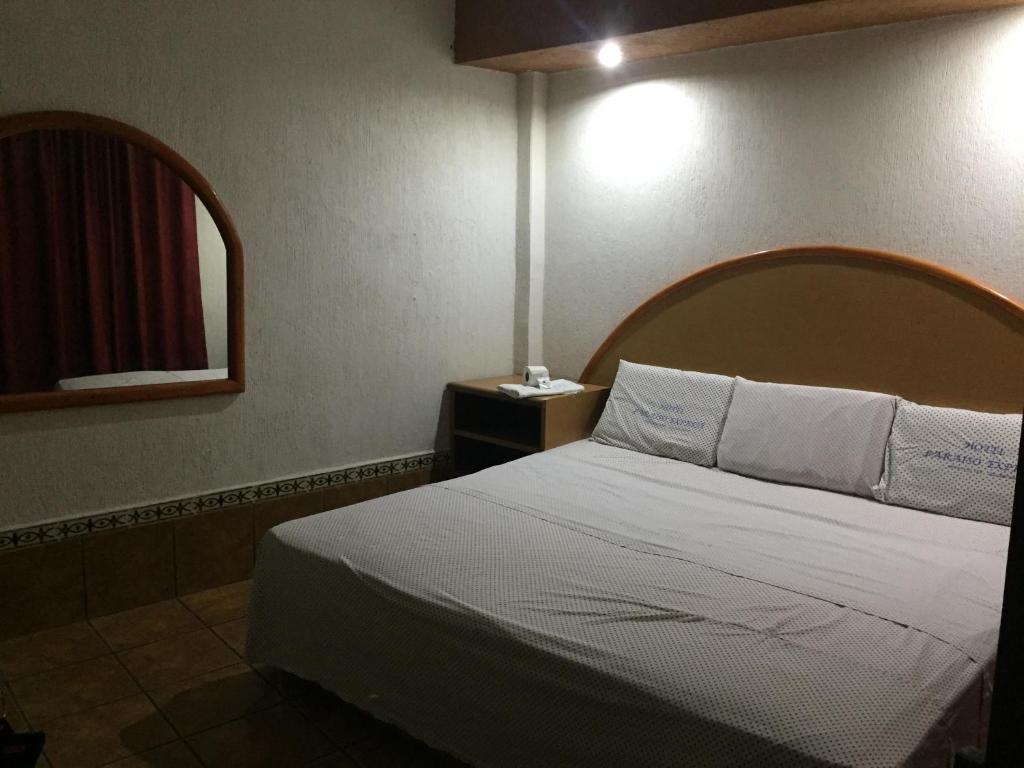 Postel nebo postele na pokoji v ubytování Hotel Paraiso Express