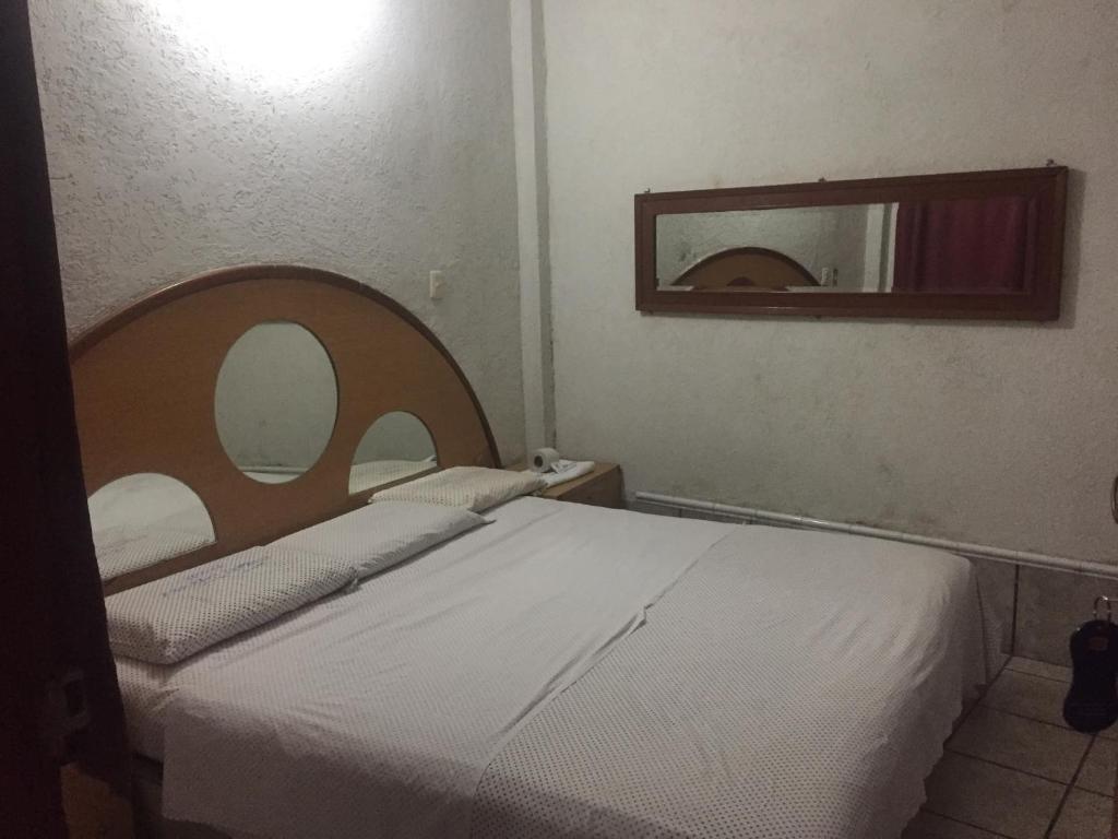 Postel nebo postele na pokoji v ubytování Hotel Paraiso Express