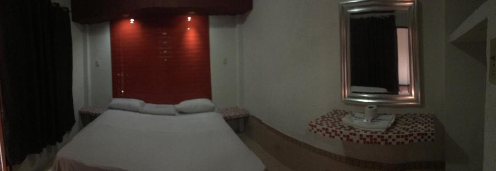 Postel nebo postele na pokoji v ubytování Hotel Paraiso Express