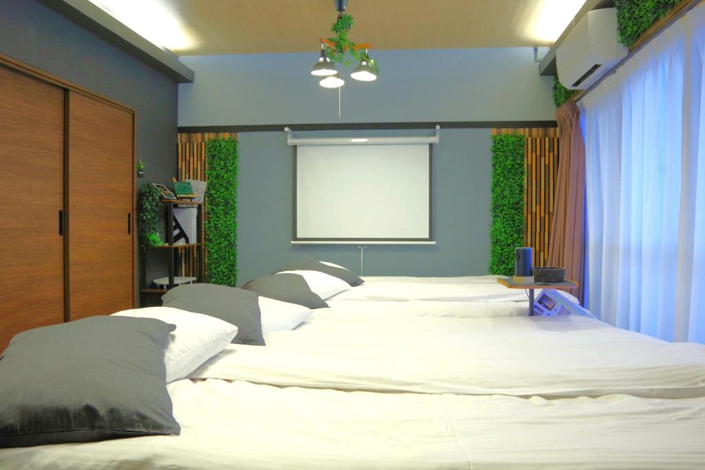 Llit o llits en una habitació de MISUZUbuilding