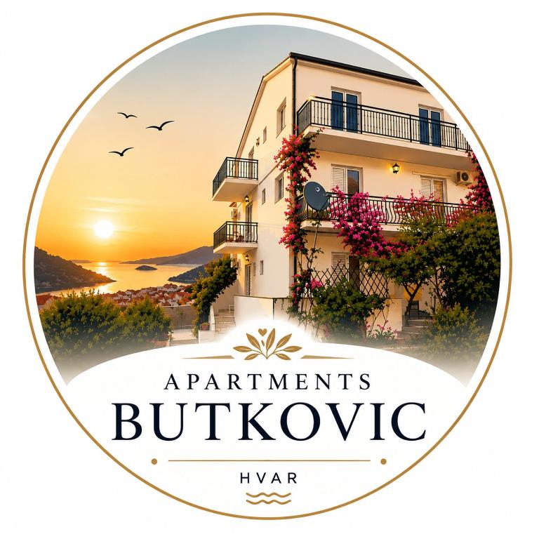 a round picture of a building with a sunset in the background at Apartments Butkovic in Hvar
