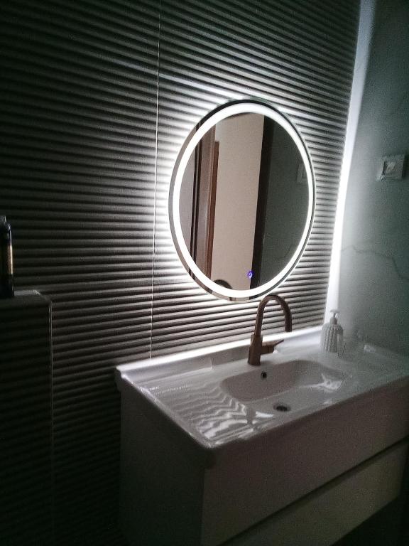 a bathroom with a sink and a mirror at Be Netivei BE NETIVOTI in Netivot