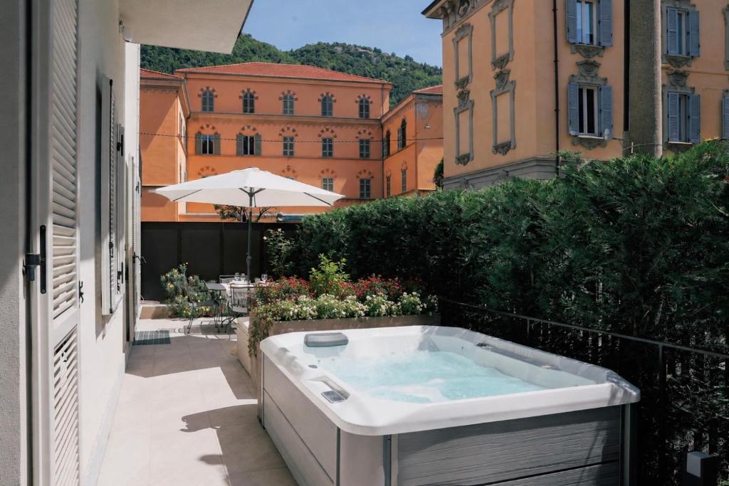 a bath tub sitting on the side of a building at La Terrazza - Private Jacuzzi in Downtown Como in Como