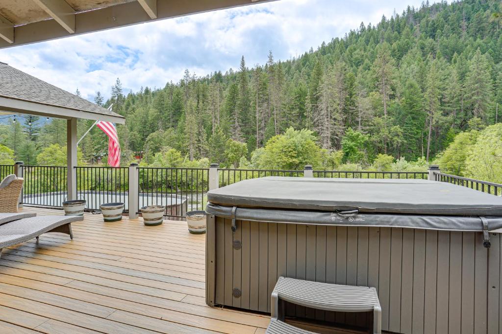 a hot tub on the deck of a house at Pool & Dual Decks! Modern Trinity River Retreat in Lewiston