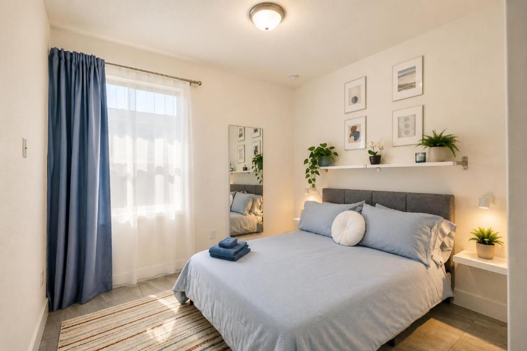 a bedroom with a large bed and a window at Avi Lux Stay in Miami