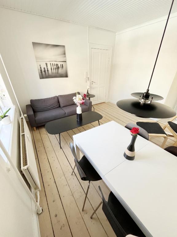 a living room with a couch and a table at Beautiful 2 Bedroom Apartment on Borgergade in Aalborg
