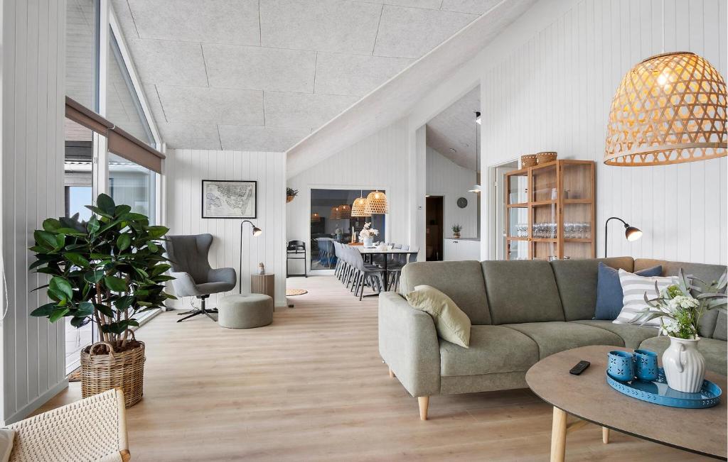 a living room with a couch and a table at Pet Friendly Home In Faaborg With Sauna in Faaborg