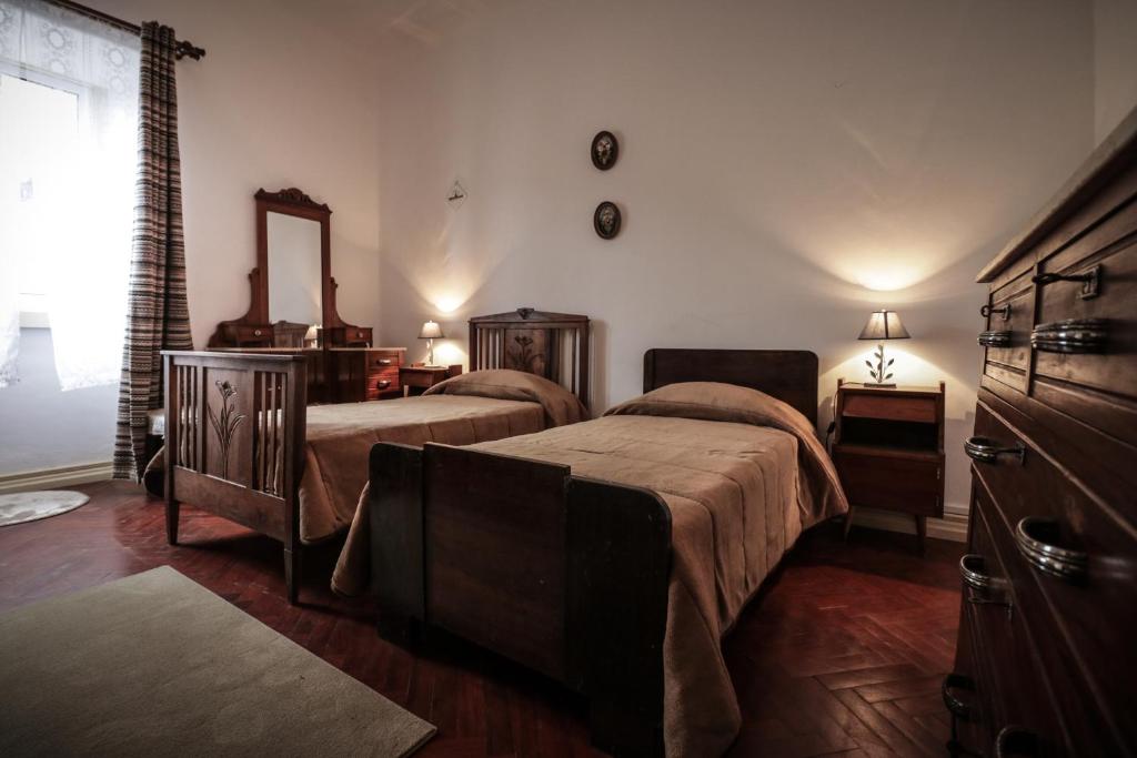A bed or beds in a room at Casa com Quinta Tradicional