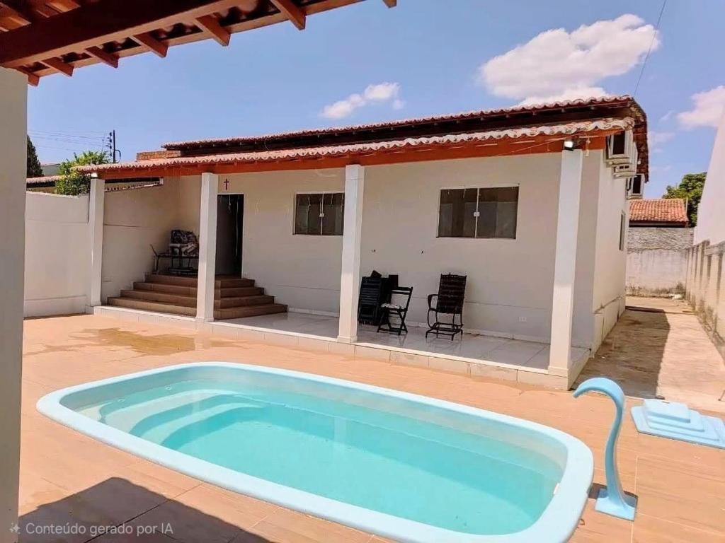 a house with a large pool in front of it at Casa em Piranhas com piscina in Piranhas