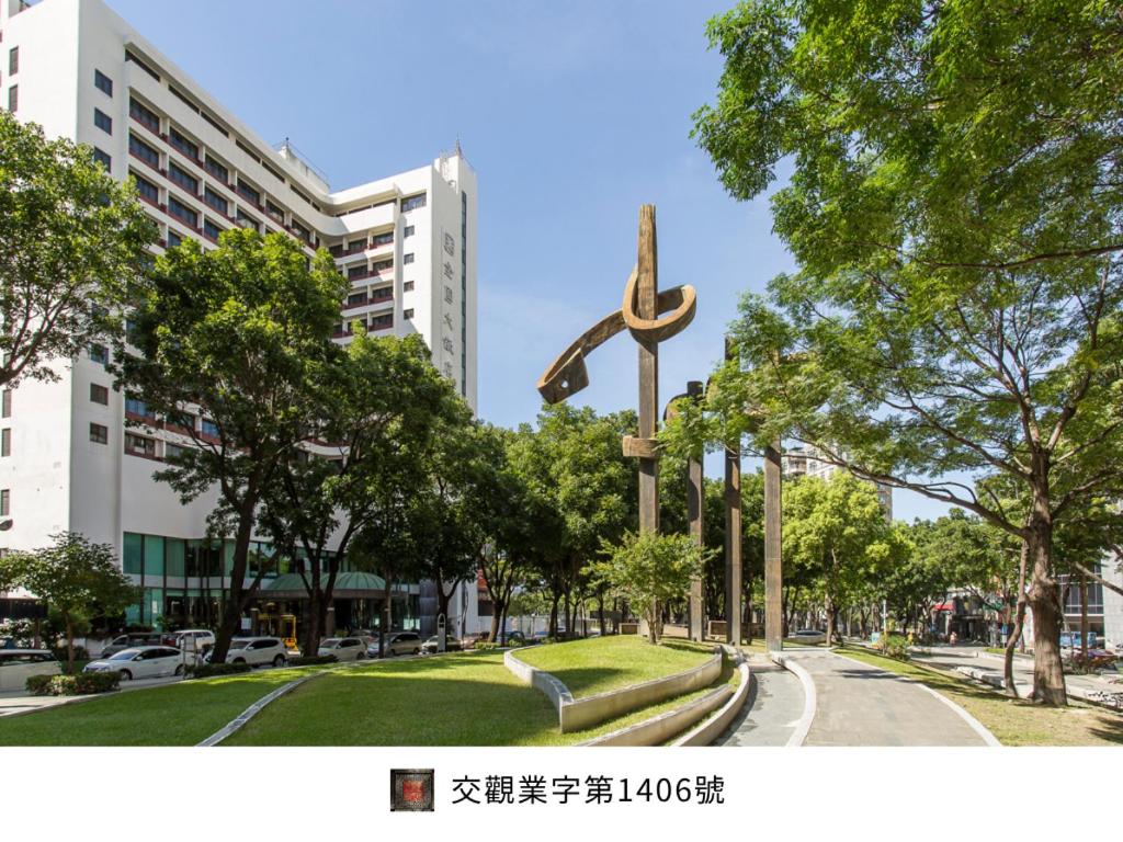 a large statue in the middle of a park at Hotel National in Taichung