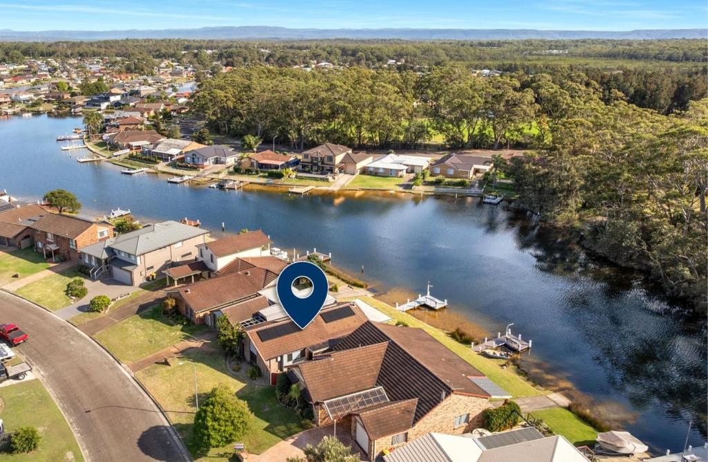 an aerial view of a house on a river at Glassy Waters in Sussex Inlet