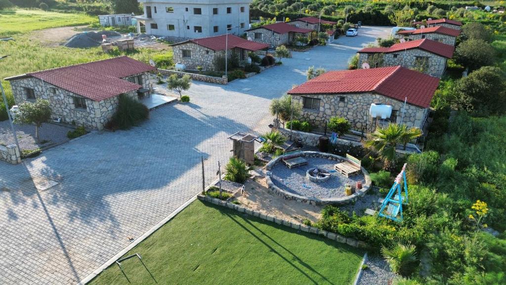 an aerial view of a house with a swimming pool at Borak's Stone Village in Rizokarpaso